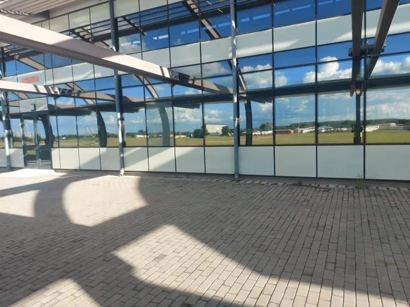 Nanoshade Silver 20 reflective privacy window film on curved office park facade in Gauteng for daytime privacy and heat reduction