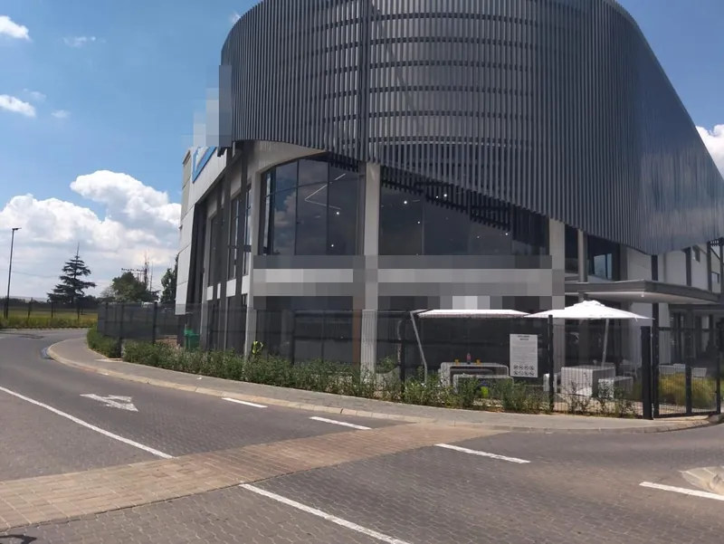 Nanoshade Sola-X charcoal solar window tint installed on commercial cafe facade in Johannesburg for heat and glare reduction